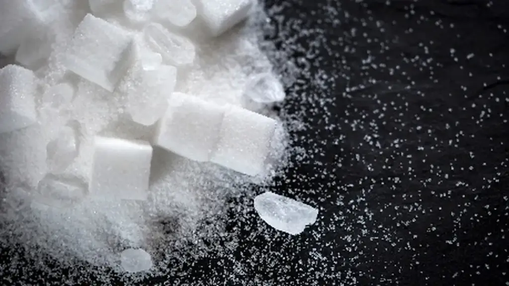 Sugar cubes and crystals on a dark background